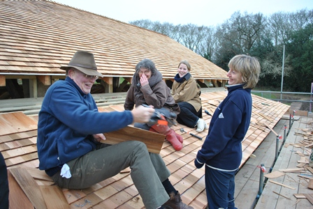 Bedales head on the new pavilion roof