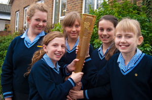 Burgess Hill School for Girls holding a prototype of the Olympic torch