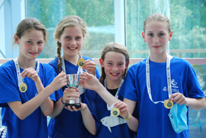 St Swithuns Girls show off their medals.